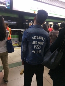 Saw this guy in Shanghai I dont think Ill ever come close to understanding the reasoning behind those words being on his jacket