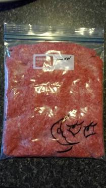 Seems like the logical next step when you have a sharpie and a bag of raw meat