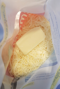 Seems like the shredded cheese machine was not having a good day