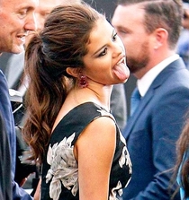 Selena paying tribute to Miley at the premiere of Getaway yesterday