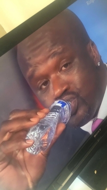Shaq makes the water bottle look like its kid size