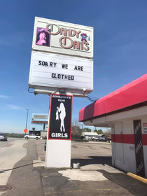 Sign for a strip club in Denver in the age of coronavirus