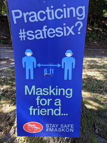 Sign greeting churchgoers using a city park for an outdoor service