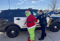 Sioux Falls police department arrests Mr Grinch for attempting to steal holiday cheer