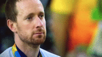 Sir Bradley Wiggins pulling a face during the national anthem in the gold medal ceremony