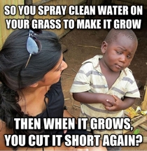Skeptical third world kid on watering the lawn