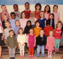 So my friend posted his daughters class picture Notice anything weird