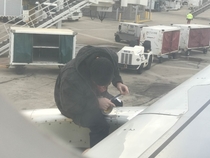 So our Spirit flight got delayed due some malfunction Then I saw some guy duct taping our engine to a wing WTF