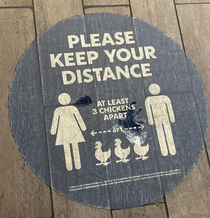 Social distancing sign at a fast food chicken place