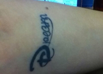 Someone I know got a tattoo that says Dream I think it looks like Pecan