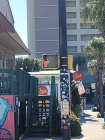 Someone in Folly Beach SC changed this dont walk sign to tell us to rock on