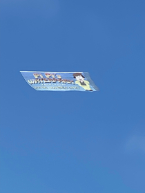 Someone in La Jolla is flying a Pi Pis Waterpark banner around from South Park It says Were Number One