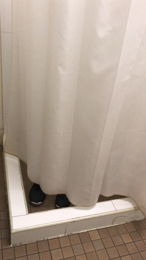 Someone moved my gym shoes into our office showertoilet so I adjusted them slightly into view from the toilet seat