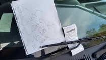 Someone parked across two parking spaces at my university Someone else was happy about their parking ticket