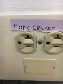 Someone put a helpful label on the electrical outlet at school