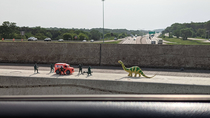 Someone set up these toys on a road construction barricade