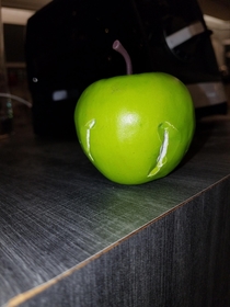 Someone took a bite out of a plastic apple