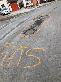 Someone Trying to get the council to fix the potholes in an ingenious way