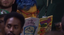 Someone went to the CelticsBucks game as Milhouse from the Simpsons and read a Radioactive Man comic during every timeout Now thats commitment