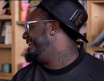 T-Pain has a neck tattoo that just says Tattoo