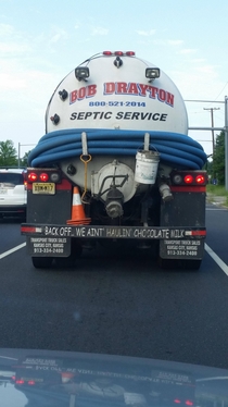 Tailgate warning on a truck hauling septic waste