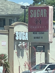 Taking Orders from a Strip Club Sign