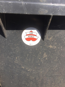 Testicular cancer promotional sticker on the bin at work