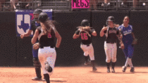Texas high school softball catcher knocks baserunners to the ground as they cross home plate