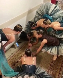 The Bolshois dancers watch football in the backstage