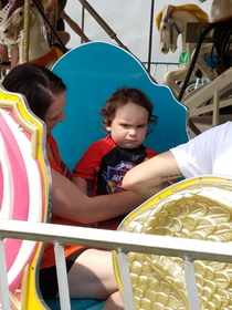 The grumpy award goes to Random kid on the merry-go-round