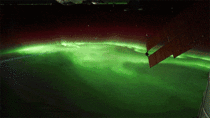The International Space Station flying over the Northern Lights