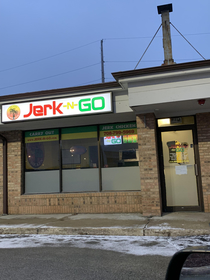 The jerk chicken joint I pass on my morning commute makes me chuckle
