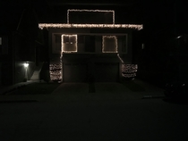 The lights say Merry Xmas the house says Happy Hanukkah