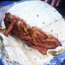 The little old lady who owns the local taco stand speaks Spanish I dont and somehow this was the result of one of your bacon breakfast burritos please