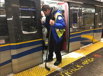 the most Canadian thing ever - using hockey sticks to dislodge frozen train doors