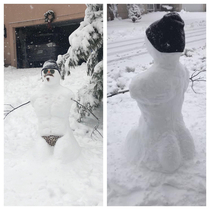 The neighbors made a snowman for the neighborhood to enjoy