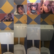 The photos above the male toilets in the water park I visited today