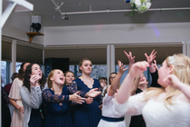 The reaction of my sister v me during the bouquet toss makes me smile were the ones in the matching dresses