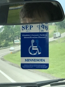 The reflection from the other side of the handicap pass looks like theyre having wheelchair sex