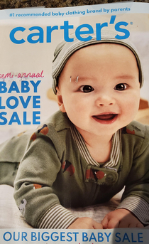 the scuff on this flyer makes it look like the baby has dual eyebrow piercings