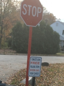The sign under the stop sign