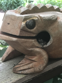 There is a frog inside this frog statue