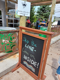 These two signs posted next to each other at a local brewery