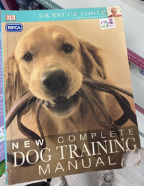 This book on dog training has a corner bitten off