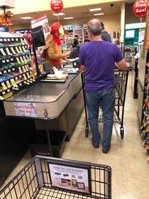 This cashier dressed as a turkey has been gobbling over the intercom every few minutes