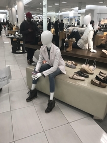 This clothing store is so boring that even this mannequin is waiting on its spouse to be done already