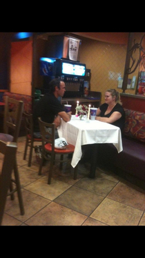 This couple enjoying a candlelit dinner at our local Taco Bell