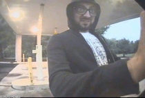 This guy put a skimmer in a ATM and local police release the photo to the public taken by the ATM His disguise was by wearing x magnification glasses I cant stop looking at his expression