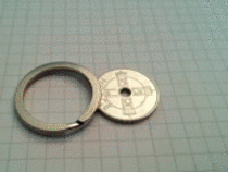 This key chain ring fits perfectly over a coin Its incredibly satisfying