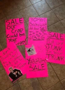 This ladys yard sale signs